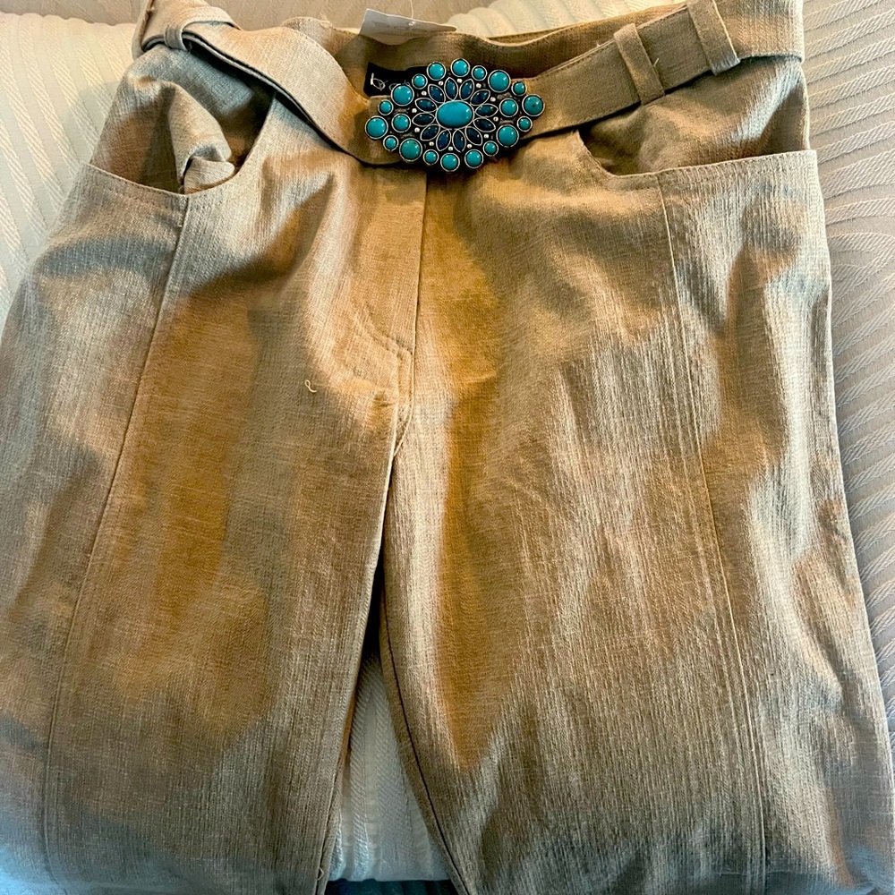 Bebe Designer pants. Straight leg, slightly flared with turquoise studded belt.